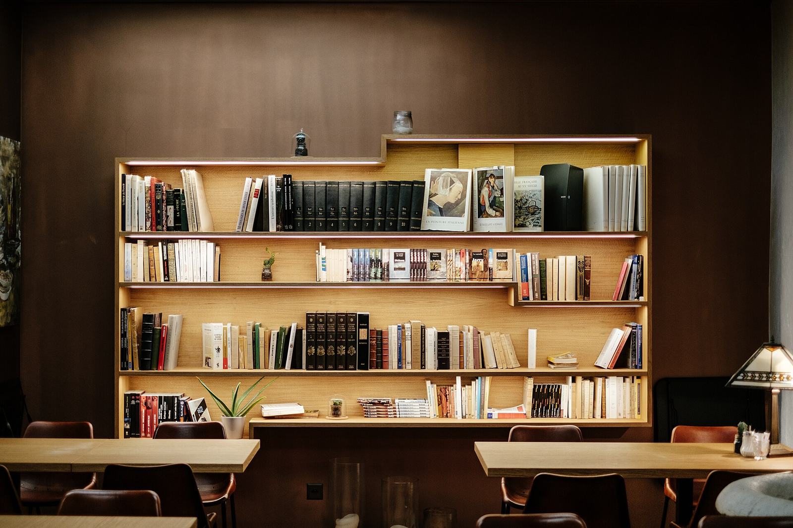 Wooden bookshelves and reading tables in a quiet reading room